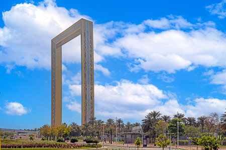 Dubai Frame monument with palm trees and blue sky during daytimeの写真素材