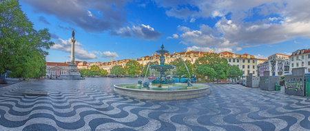 Wide view of Rossio Square with statue fountain and historic buildings in Lisbonの写真素材