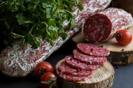 Black background with sausagesの写真素材