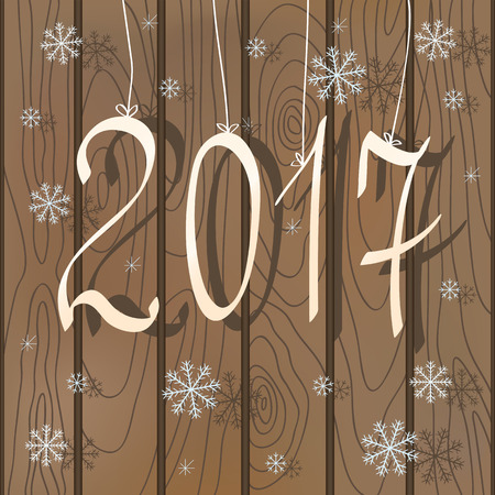 Seasonal greetings card with elegant white numerals 2017 and Christmas falling snowflakes on the background brown wooden fence. Country style.のイラスト素材