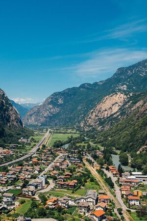 Beautiful landscape in the Aosta Valley mountainous region in northwestern Italy. Alpine valley in summer seen from fort Bard. Hone, Bard, Valle d Aosta.の写真素材