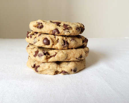 Delicious freshly baked homemade chocolate chip cookies. Stack of tasty cookies on white background....