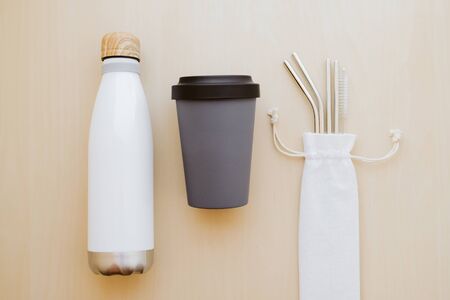 Reusable plastic free and eco friendly utensils. Metal drinking straws, bamboo cup and water bottle.の写真素材