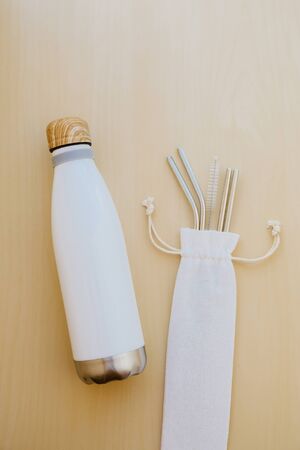 Reusable plastic free eco friendly utensils. Water bottle and metal drinking straws.の写真素材