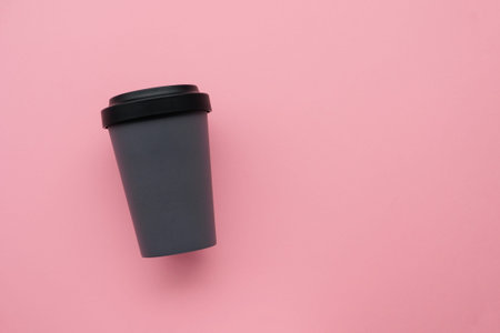 Reusable stylish eco friendly gray bamboo cup on pink background with copy space.の写真素材