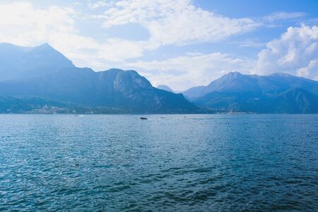 Beautiful view of Como Lake or Lago di Como in summer. Popular tourist attraction in Lombardy, Northern Italy. Summer vacations concept.の写真素材