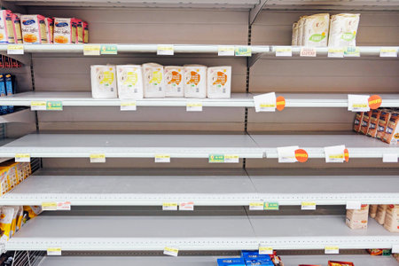 Brandizzo, Italy - March 2020: Empty shelves in a supermarket store. Coronavirus outbreak, COVID-19 quarantine. No more groceries on shelves.のeditorial素材