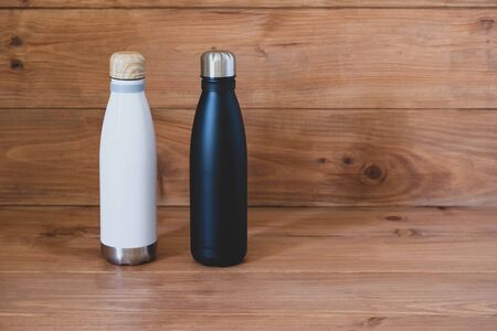 Reusable eco-friendly black and white tainless steel thermo bottles.の写真素材