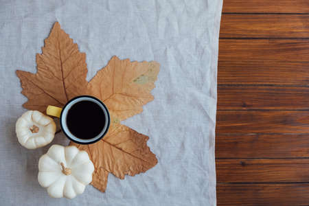 Autumn flat lay with a cup of hot drink.の写真素材