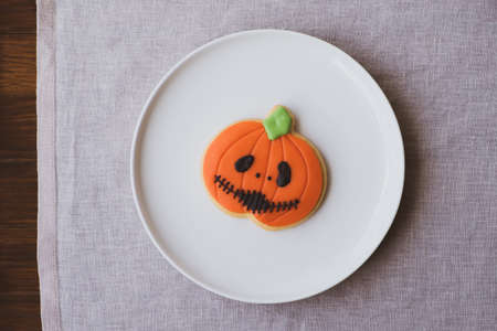 Funny Halloween jack o lantern pumpkin cookie.の写真素材