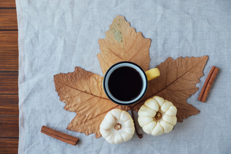 Autumn flat lay with a cup of hot drink.