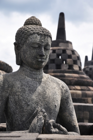 Buddha sitting on the ruin of Borobudurの写真素材