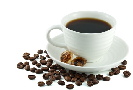 Small white porcelain cup and saucer of hot black turkish coffee, caramel brown sugar crystals and coffea arabica beans  Coffee culture concept  Isolated on white の写真素材