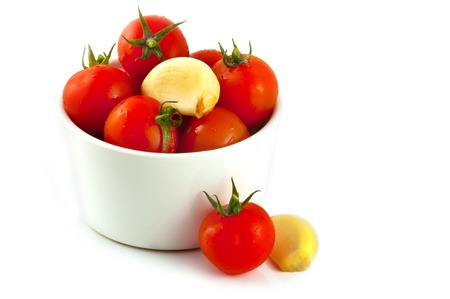 Set of pickles tomato and garlic isolated on white backgroundの写真素材