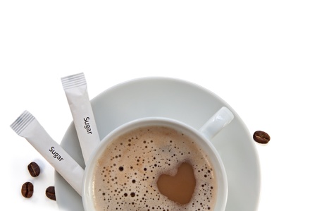 cup of cappucino coffee, beans of coffea arabica, sugar isolatedの写真素材