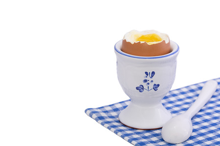 Healthy breakfast with soft boiled egg isolated on whiteの写真素材