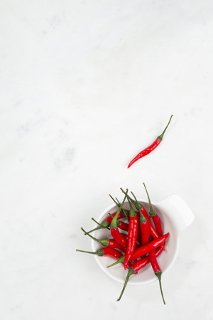 Red hot pepper on gray marble table  Concept of spicy cuisine の写真素材