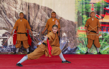 HONG KONG - MAY 3  Unidentified monk of Shaolin temple performs wushu at Po Lin monastery on May 3, 2014 in Hong Kong, China  Group of Shaolin monks do no-charge show to promote chinese martial arts のeditorial素材