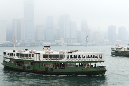 HONG KONG - MAY 4  Star Ferry arrives to Kowloon pier on May 4, 2014 in Hong Kong, China  Star Ferry has multiple routes between HK destinations for over 120 years and is one main tourist attractions のeditorial素材