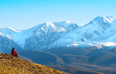 Silhouette of traveller in a Mountainsの写真素材