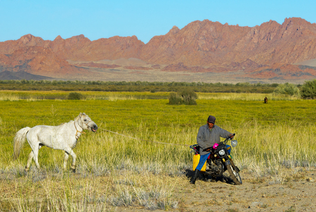 Unidentified shepherd rides motorbikeのeditorial素材