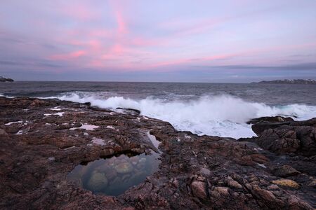 Sunset over the Barents Sea. Scenic shore nearby of Murmansk, Polar Circle.の写真素材