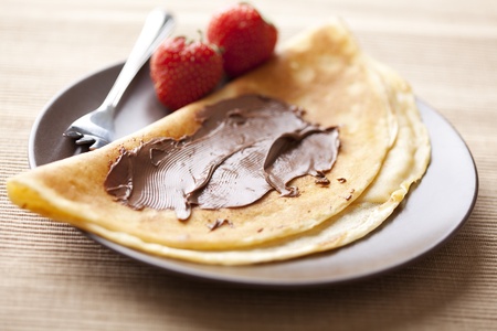 crepe with chocolate spread and strawberriesの写真素材
