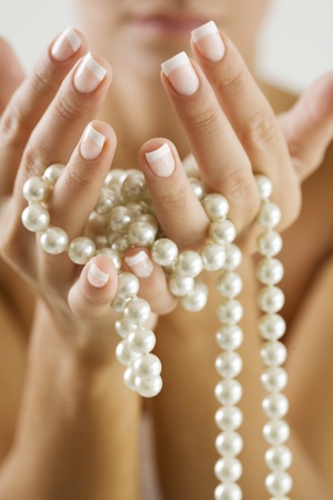 female hands with pearlsの写真素材