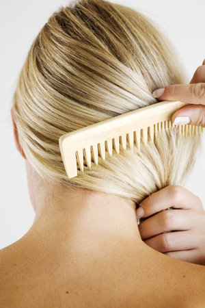 woman combing hair