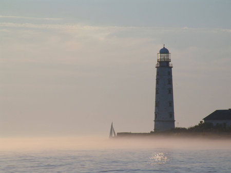 Khersones lighthouse and sailing boatの写真素材
