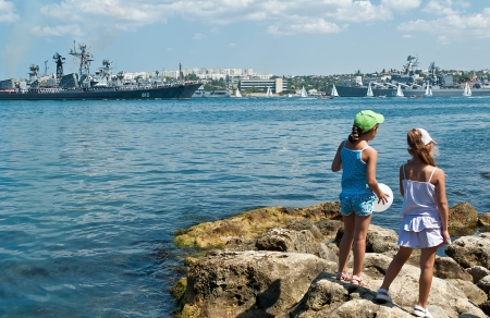 Little girls watching for celebration of Russian Navy Day in Sevastopol cityのeditorial素材
