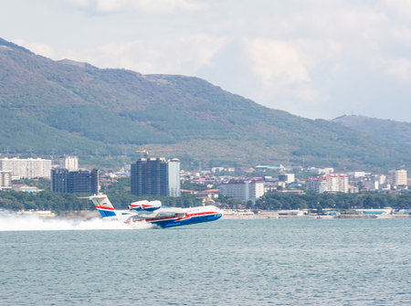The Beriev Be-200 ES "Altair" type (in Russian: Be-200 ChS) multipurpose amphibious aircraft known as "water bomber" take-off from the surface of Gelendzhik bay during 11-th International Exhibition on Hydroaviation GIDROAVIASALON-2016,Russian Black sea cのeditorial素材