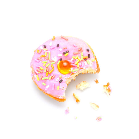 The bitten Donut with sprinkles on white backgroundの写真素材
