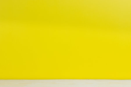 Yellow background  and wood at the bottom