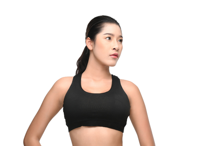 Portrait of fitness woman in black sportswear isolated on white background with clipping path.の写真素材
