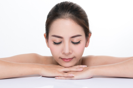 Beautiful Young Woman(Asian girl 20-25 years old) with clean fresh skin on white background.の写真素材
