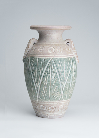Ancient clay pots deep green with beautiful patterns.の写真素材