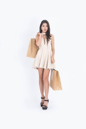 Woman hold shopping bag, Asian girl, 20-30 years old,on white background.の写真素材