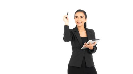 Young mixed race businesswoman wearing a black work suit with arms folded smiling in a tablet and pen in a creative position isolated on white background.の写真素材