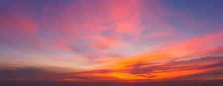 Beautiful background sunrise or sunrise sky with sunbeam over the sea. Copy space and banner composition.の写真素材