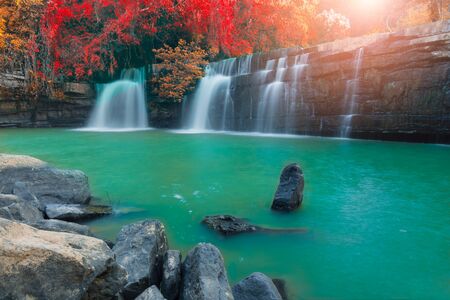 Beautiful waterfall In the fall autumn forest.の写真素材