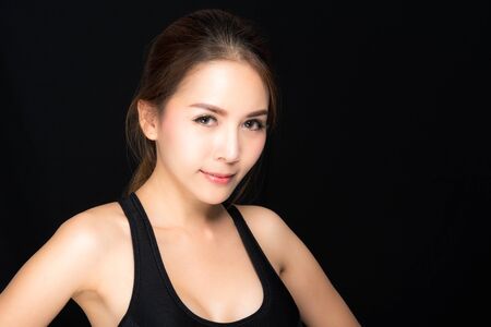 Fitness sport women in fashion sportswear fitness exercise isolated on black background.の写真素材