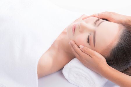 Close up, Beautiful and healthy asian woman in white spa salon. Traditional oriental aroma therapy and beauty treatments isolated on white background.の写真素材