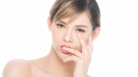 Beauty young woman with clean fresh skin, Proposing a product. Gestures for advertisement isolated on white background, at copy space.の写真素材