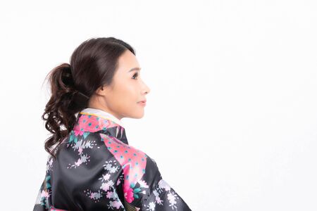 Beautiful attractive asian woman wearing traditional japanese kimono isolated on white backgroundの写真素材