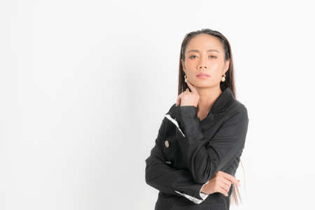 Fashion style catalog clothing for business woman black long hair natural make up wear black suit costume perfect body shape suit at studio shoot on white background and shadow.の写真素材