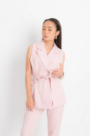 Fashion style catalog clothing for business woman black long hair natural make up wear pink suit costume perfect body shape suit at studio shoot on white background and shadow.の写真素材