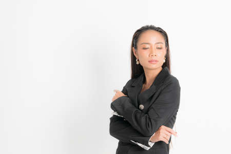 Fashion style catalog clothing for business woman black long hair natural make up wear black suit costume perfect body shape suit at studio shoot on white background and shadow.の写真素材