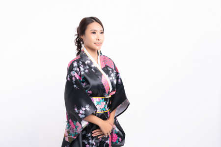 Beautiful attractive asian woman wearing traditional japanese kimono isolated on white backgroundの写真素材