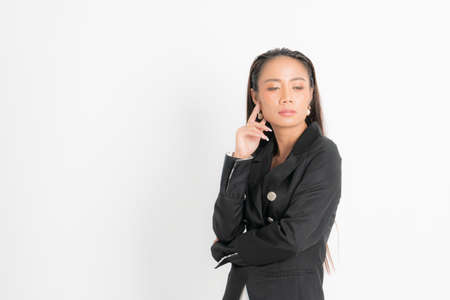Fashion style catalog clothing for business woman black long hair natural make up wear black suit costume perfect body shape suit at studio shoot on white background and shadow.の写真素材